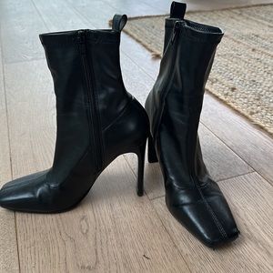 Black leather square heeled booties with shiny heel